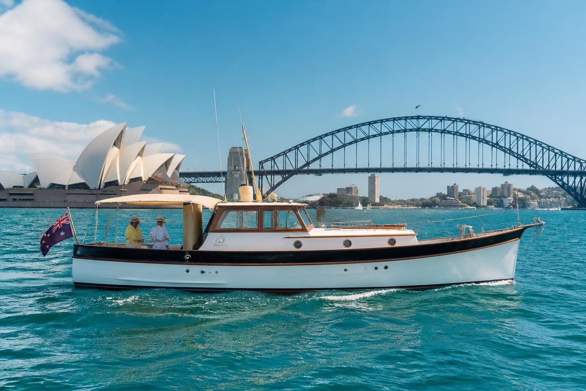 Luna vintage timber cruiser profile on Sydney Harbour with Opera House and Harbour Bridge